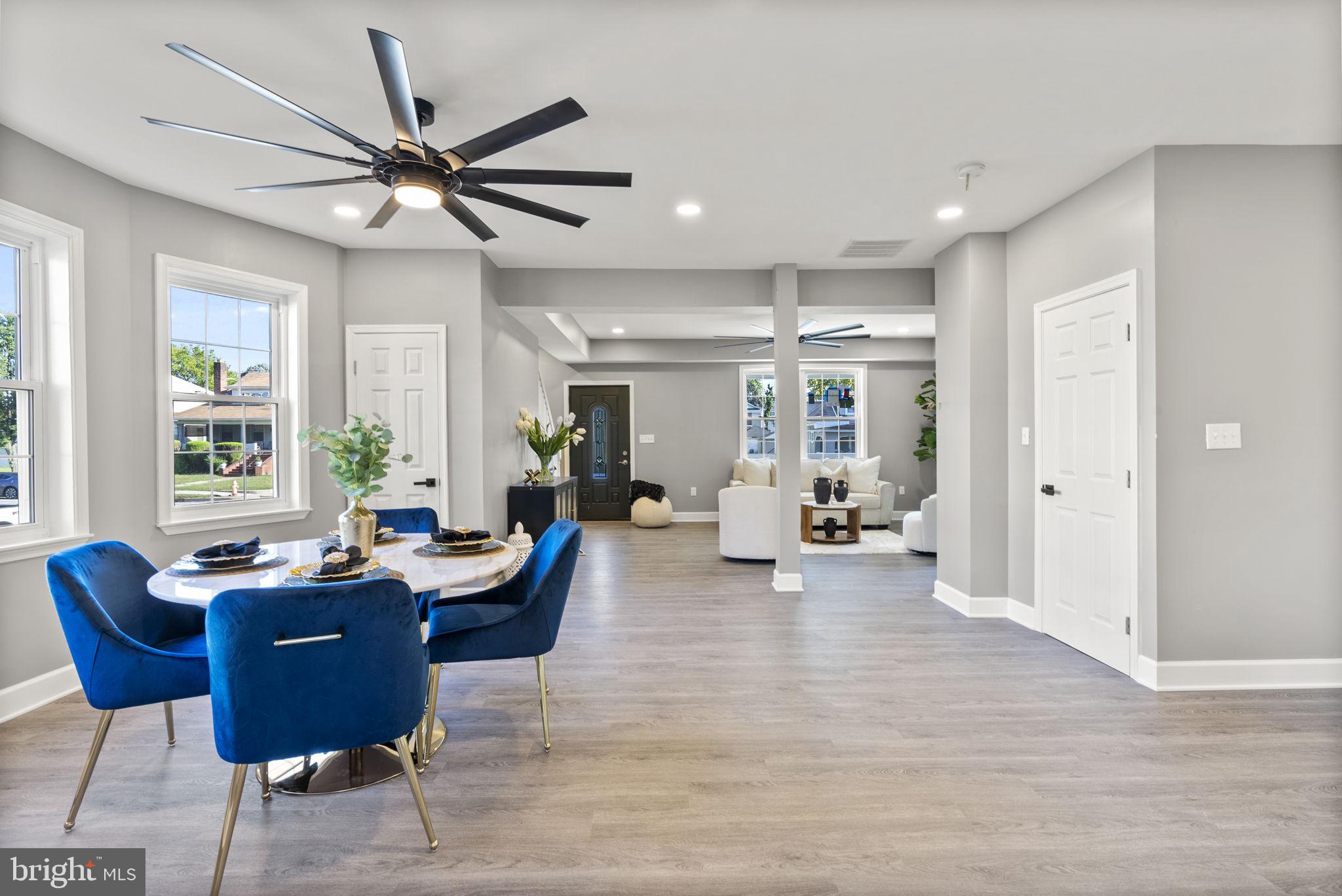3417 Springdale Avenue Baltimore, MD 21216 - Photo 10 of 60 a living room with furniture a window and a chandelier