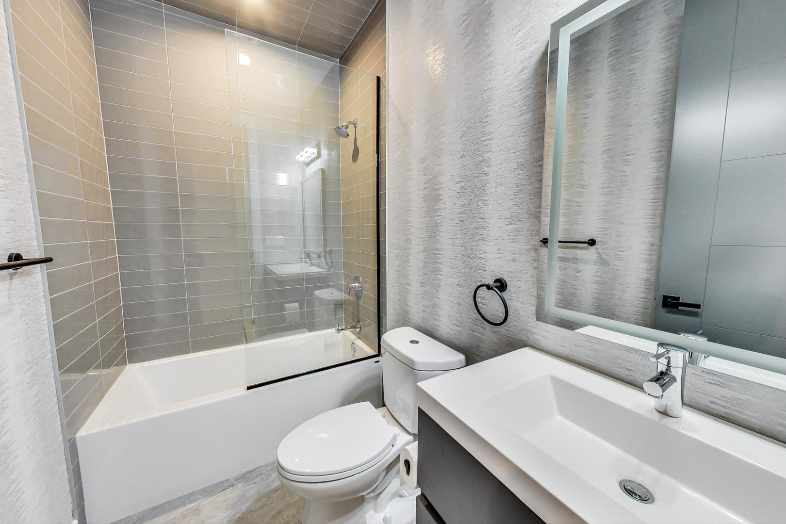 4745 South Indiana Avenue, Unit 3 Chicago, IL 60615 - Photo 11 of 42 a bathroom with a sink toilet and shower