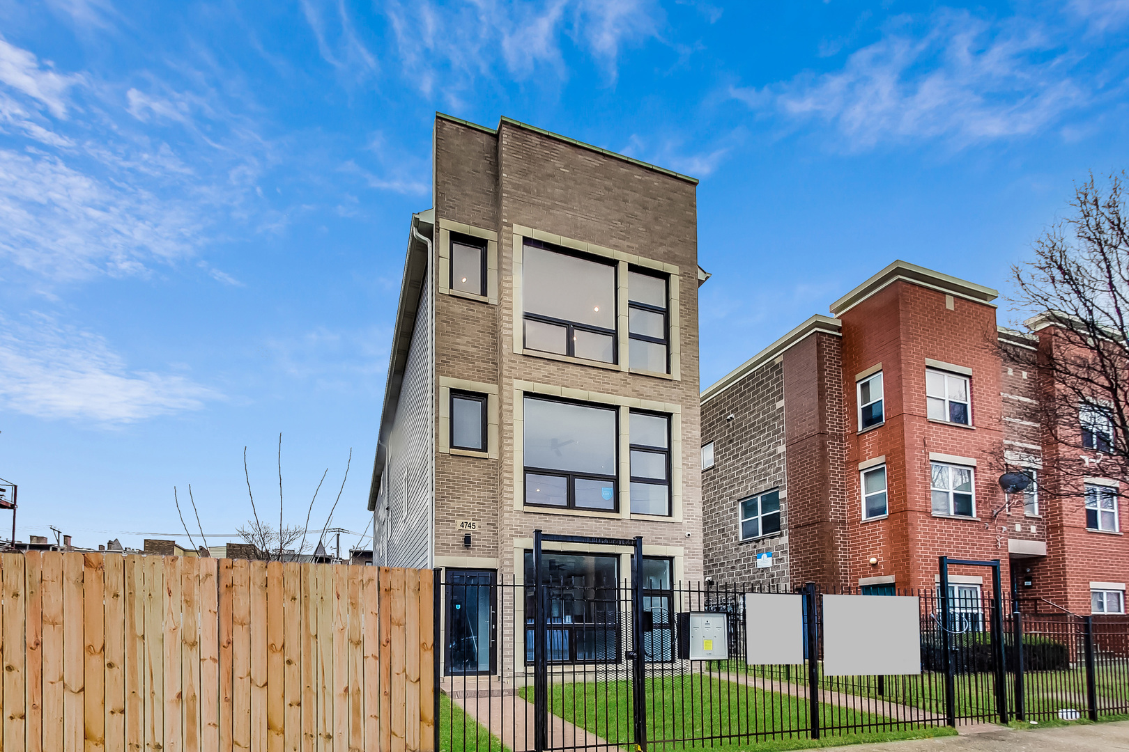 4745 South Indiana Avenue, Unit 3 Chicago, IL 60615 - Photo 2 of 42 a front view of a building with glass windows