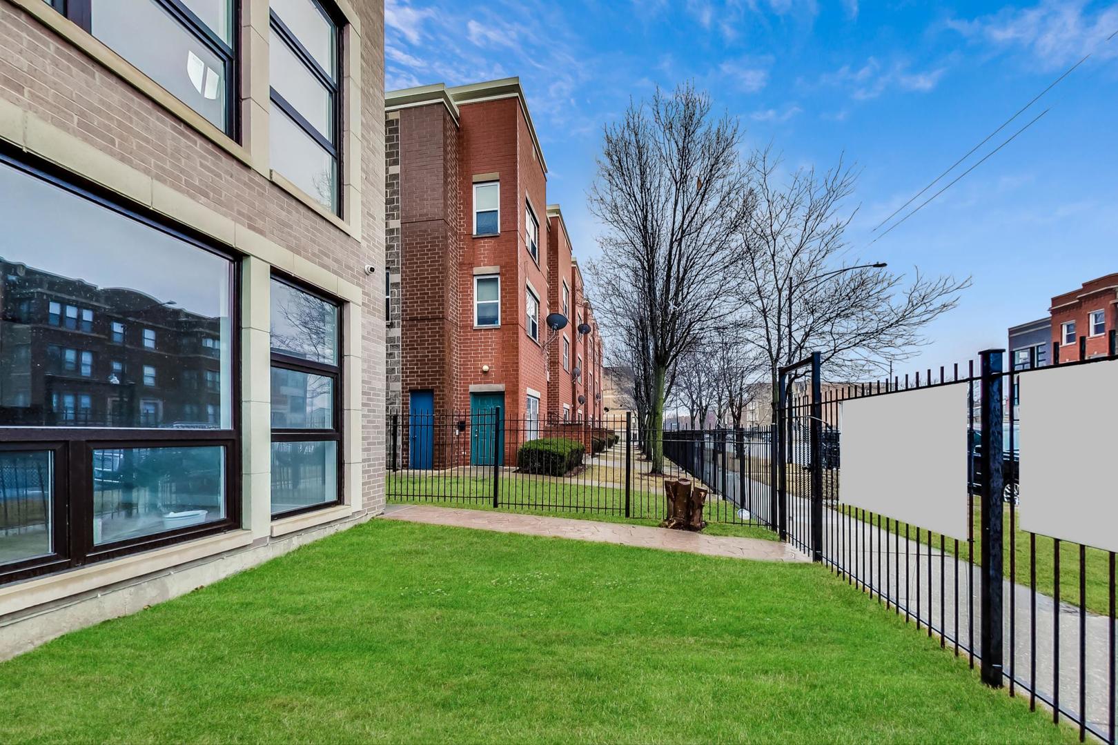 4745 South Indiana Avenue, Unit 3 Chicago, IL 60615 - Photo 22 of 42 a view of a building with a yard