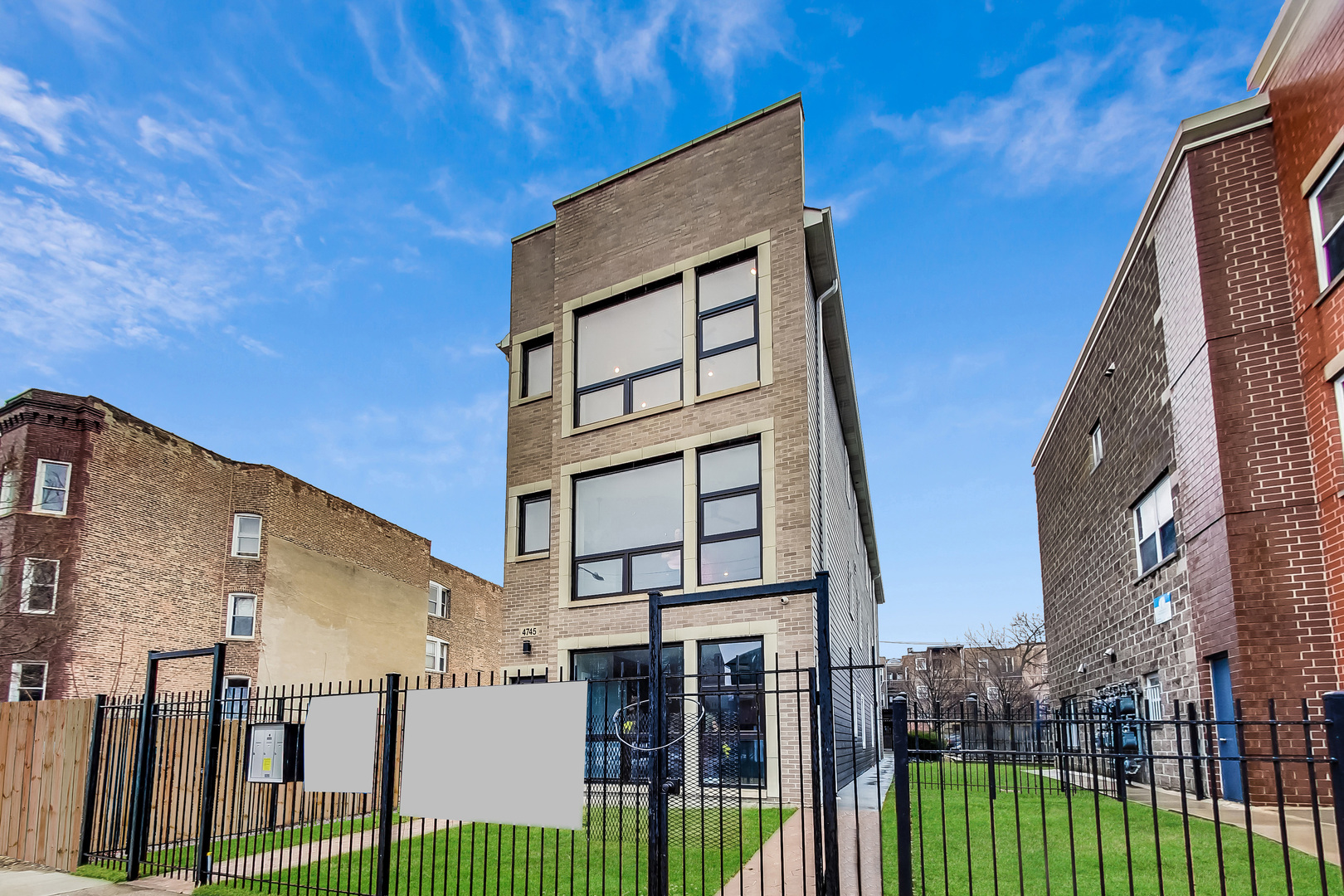 4745 South Indiana Avenue, Unit 3 Chicago, IL 60615 - Photo 3 of 42 a front view of a house with a garden