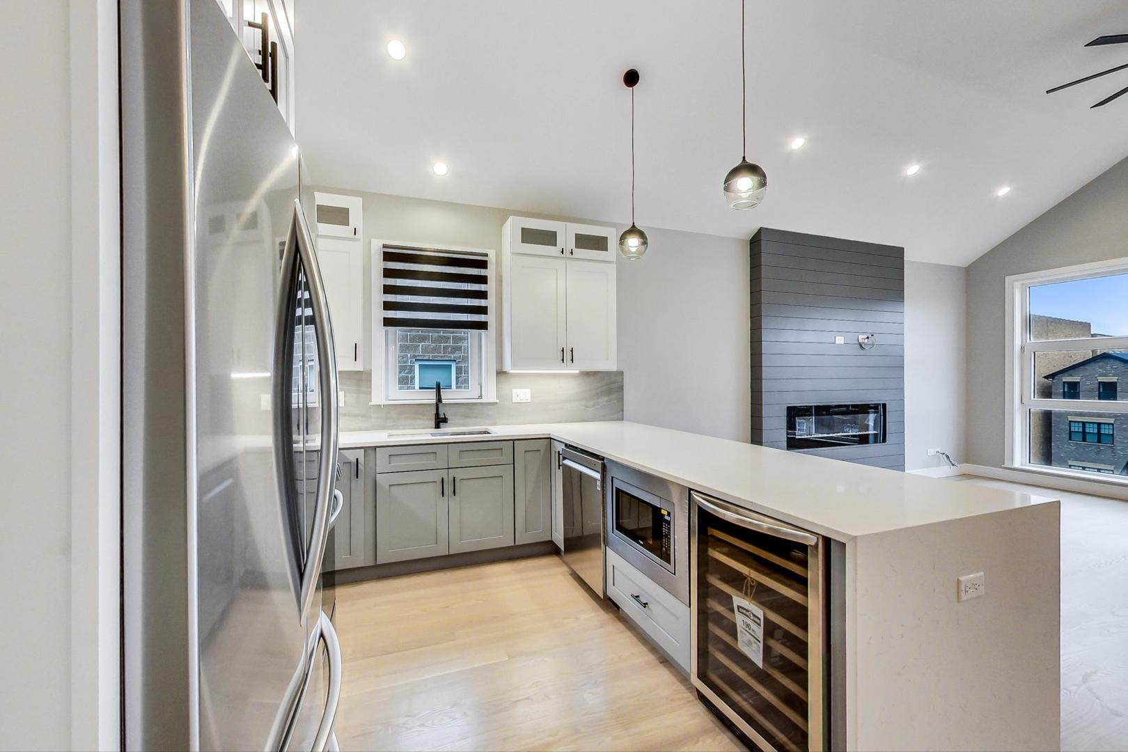 4745 South Indiana Avenue, Unit 3 Chicago, IL 60615 - Photo 32 of 42 a kitchen with a sink appliances and cabinets