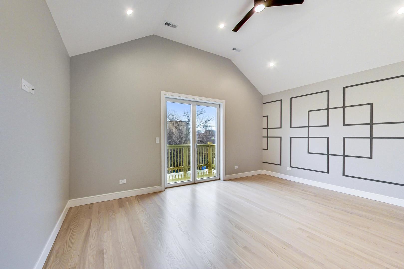 4745 South Indiana Avenue, Unit 3 Chicago, IL 60615 - Photo 34 of 42 wooden floor in an empty room with a window