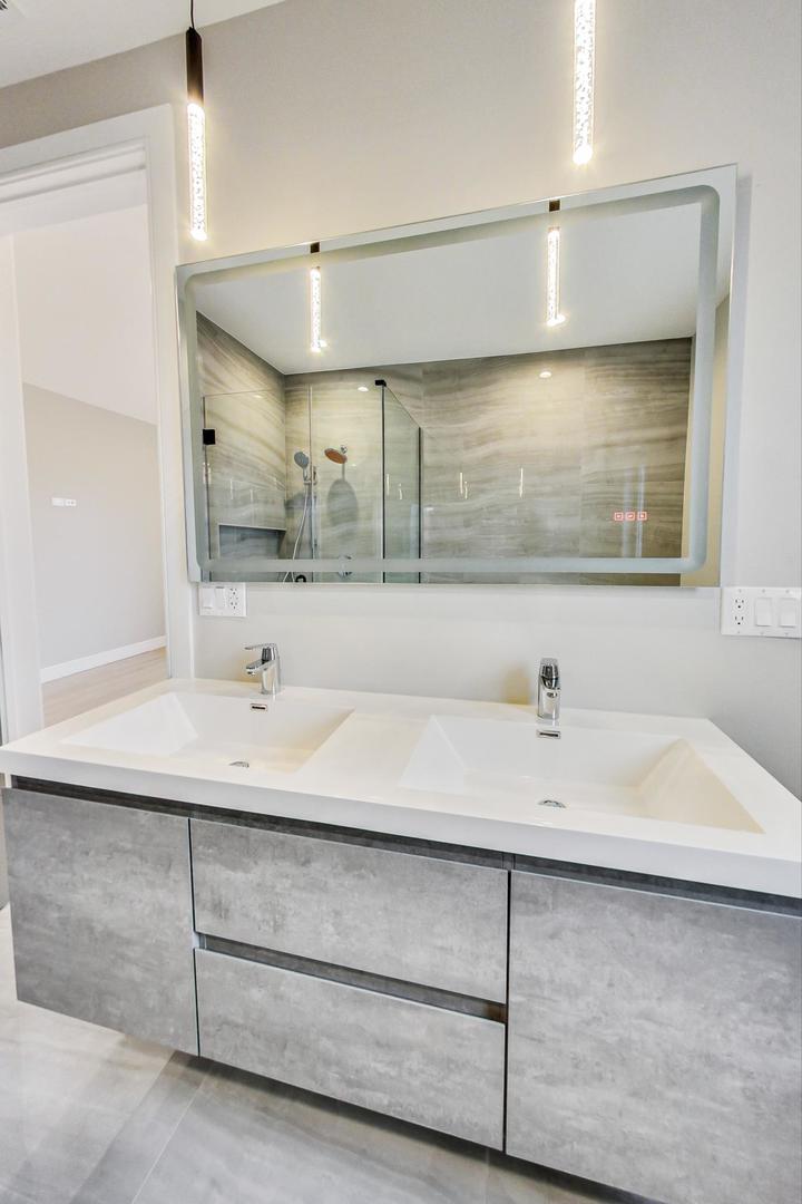 4745 South Indiana Avenue, Unit 3 Chicago, IL 60615 - Photo 39 of 42 a bathroom with a sink and a mirror