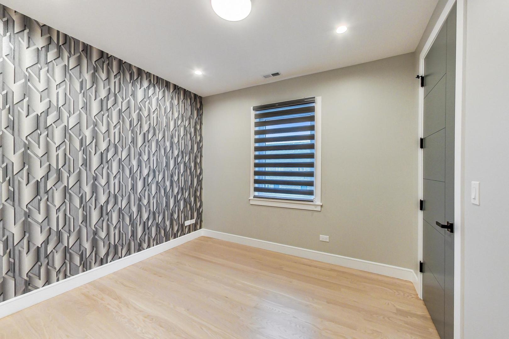 4745 South Indiana Avenue, Unit 3 Chicago, IL 60615 - Photo 4 of 42 a view of an empty room with a window