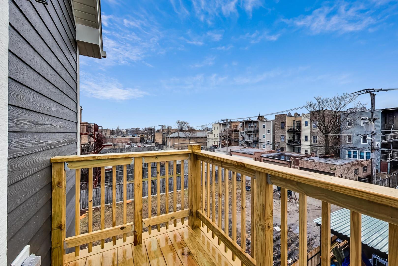 4745 South Indiana Avenue, Unit 3 Chicago, IL 60615 - Photo 41 of 42 a view of a city from a balcony