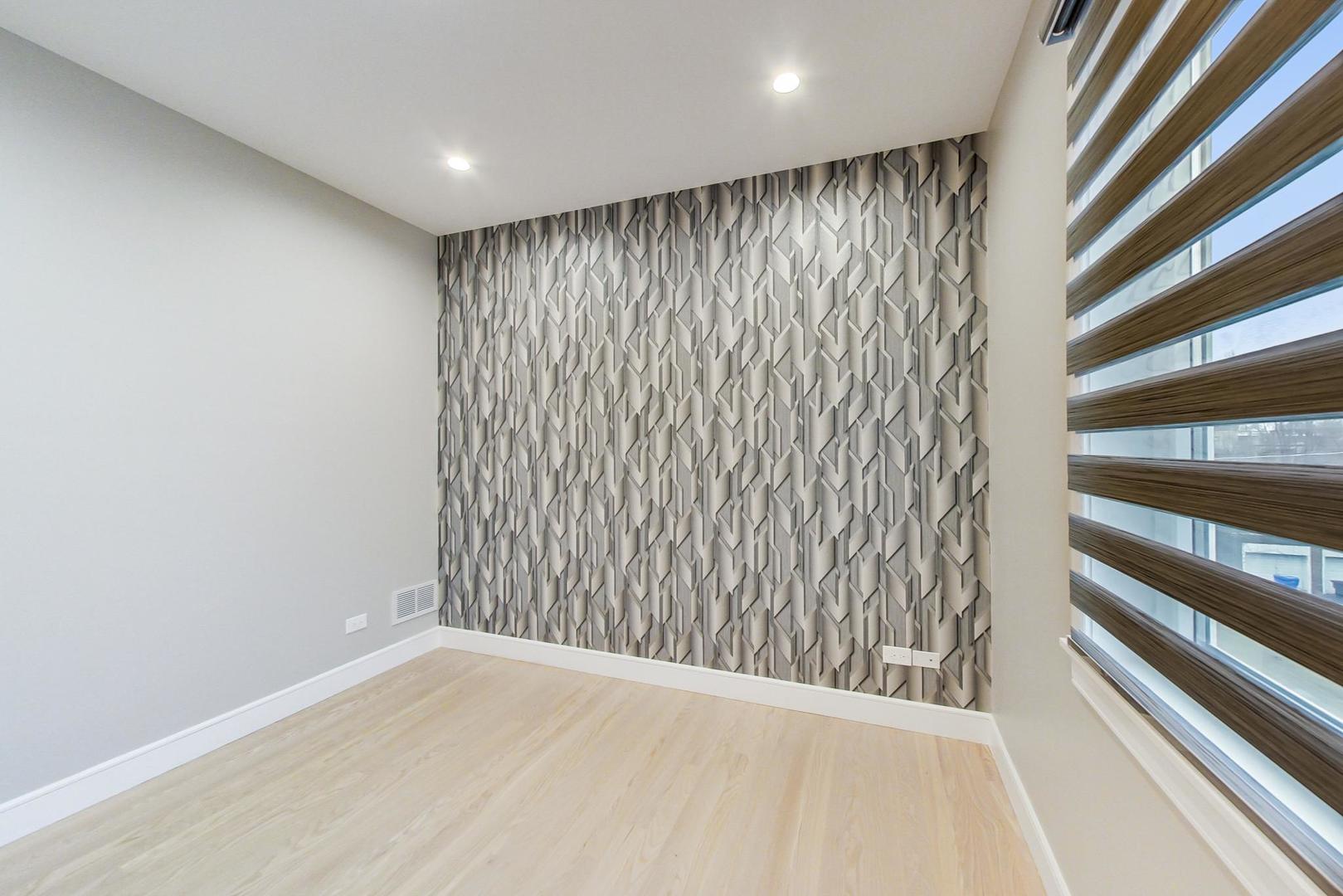 4745 South Indiana Avenue, Unit 3 Chicago, IL 60615 - Photo 5 of 42 a view of an empty room with a window