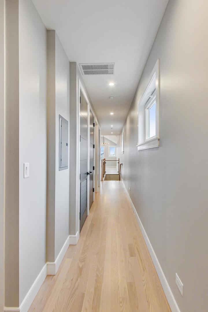 4745 South Indiana Avenue, Unit 3 Chicago, IL 60615 - Photo 10 of 42 a view of a hallway with wooden floor