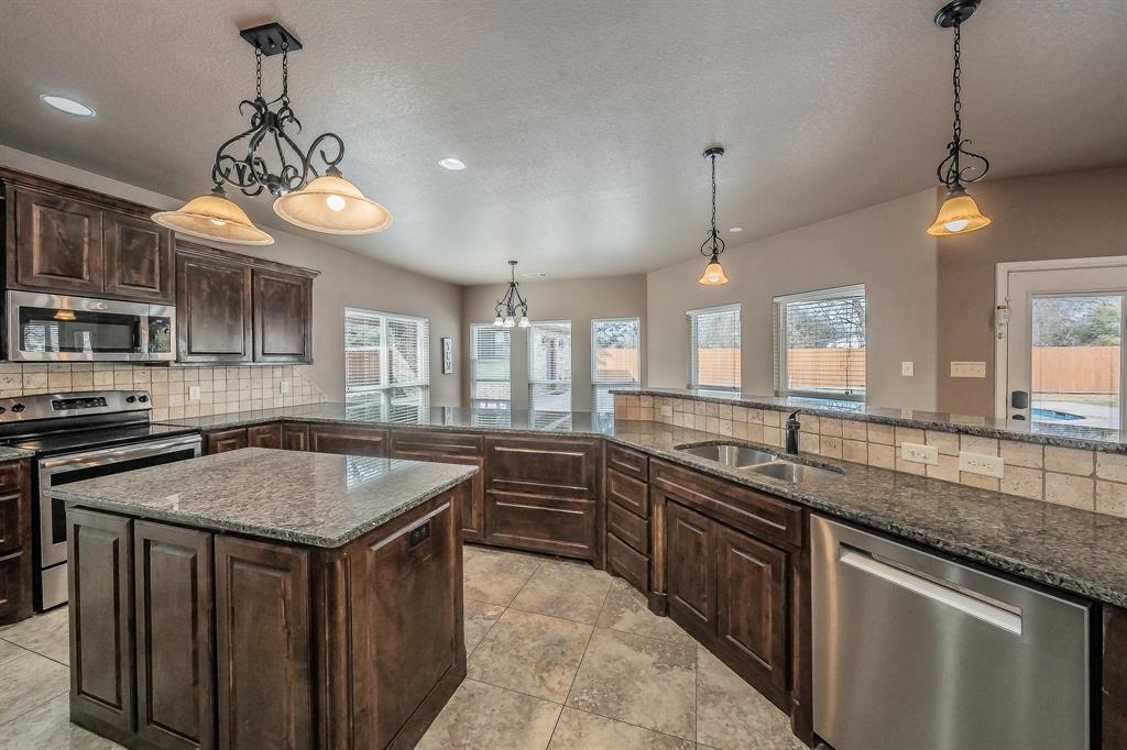 405 Edgewood Terrace Boyd, TX 76023 - Photo 11 of 39 This kitchen was meant for entertaining.