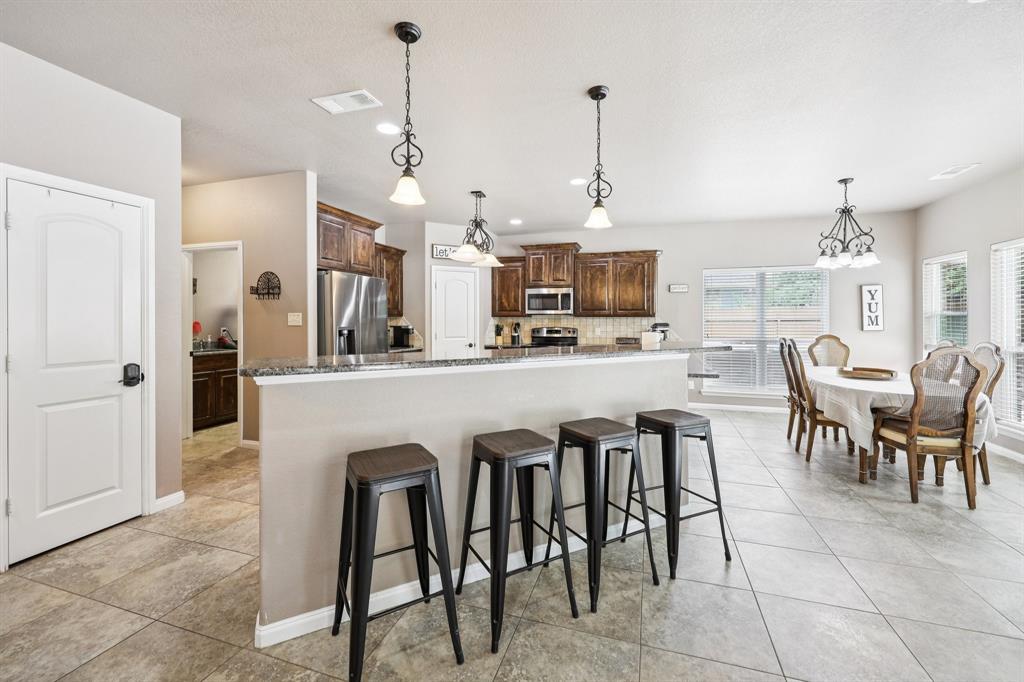 405 Edgewood Terrace Boyd, TX 76023 - Photo 12 of 39 Step inside the back door-previously staged