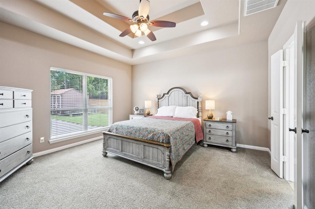 405 Edgewood Terrace Boyd, TX 76023 - Photo 14 of 39 a spacious bedroom with a bed and a large window