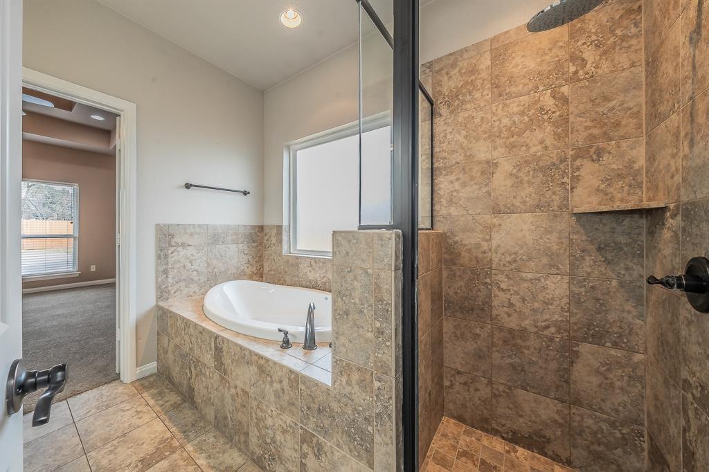 405 Edgewood Terrace Boyd, TX 76023 - Photo 18 of 39 a bathroom with a sink and a mirror