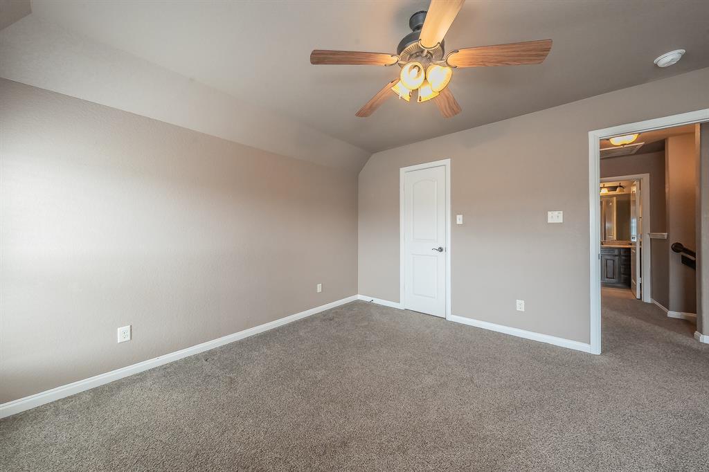 405 Edgewood Terrace Boyd, TX 76023 - Photo 26 of 39 a view of an empty room with a chandelier fan