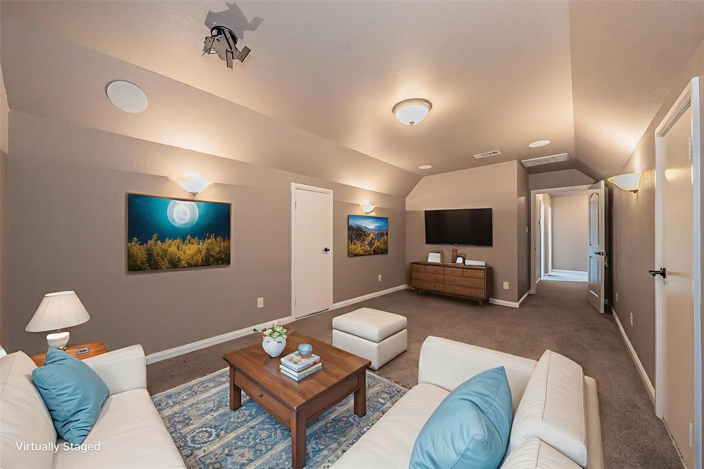 405 Edgewood Terrace Boyd, TX 76023 - Photo 31 of 39 a living room with furniture and a flat screen tv