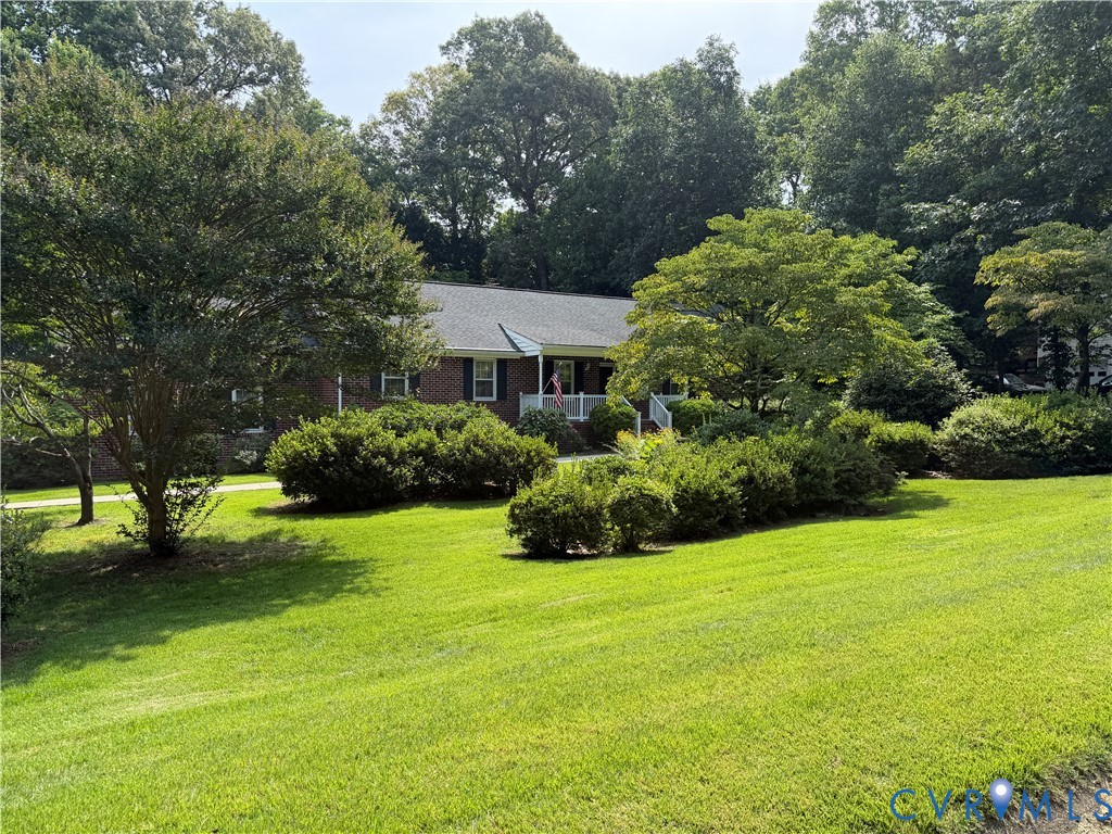 3933 Dunraven Road North Chesterfield, VA 23236 - Photo 2 of 30 a view of a house with a garden