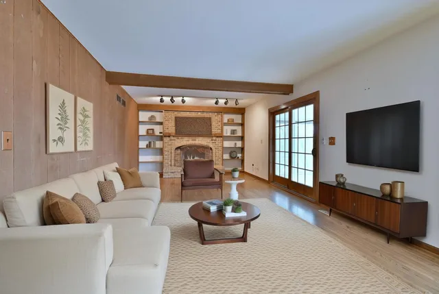 a patio with patio couch and a potted plant