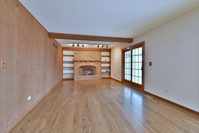 a view of a patio with wooden floor