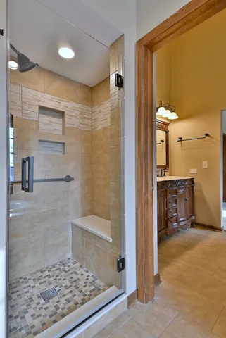 a view of an empty room with a chandelier