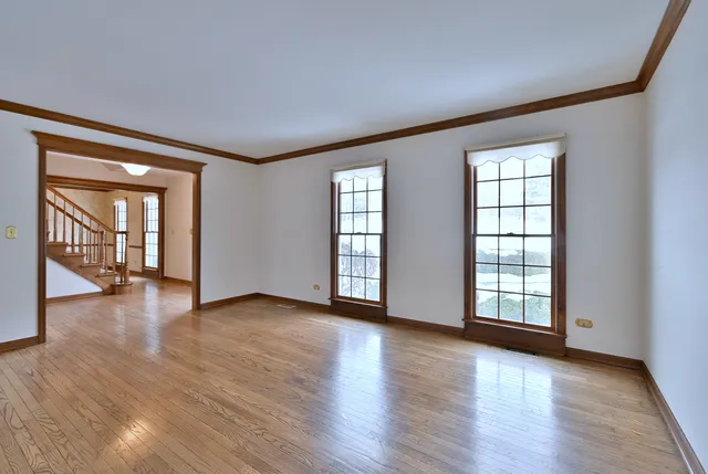 a view of an entryway with wooden floor