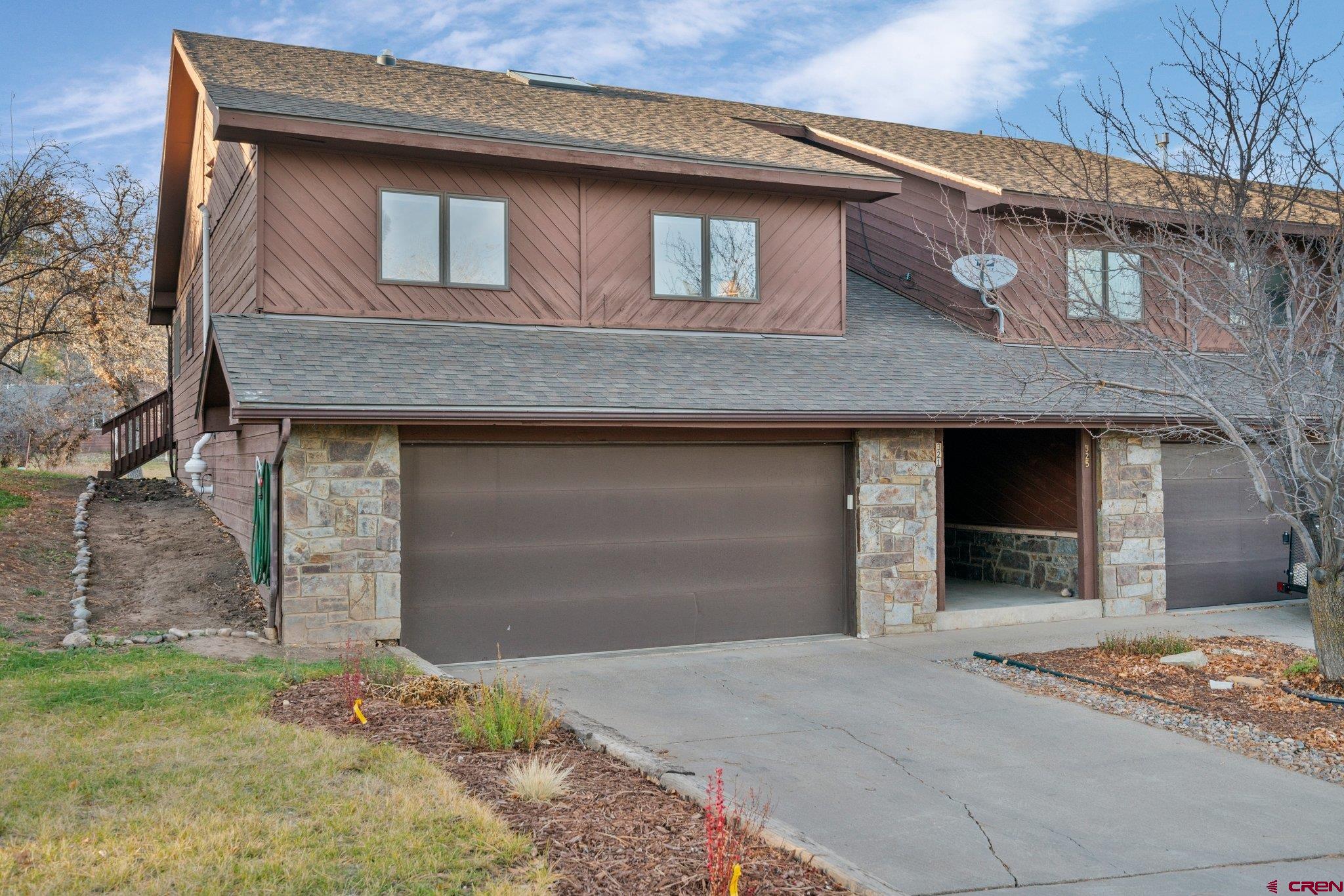 321 Pine Ridge Loop Durango, CO 81301 - Photo 1 of 35 a front view of a house with a yard