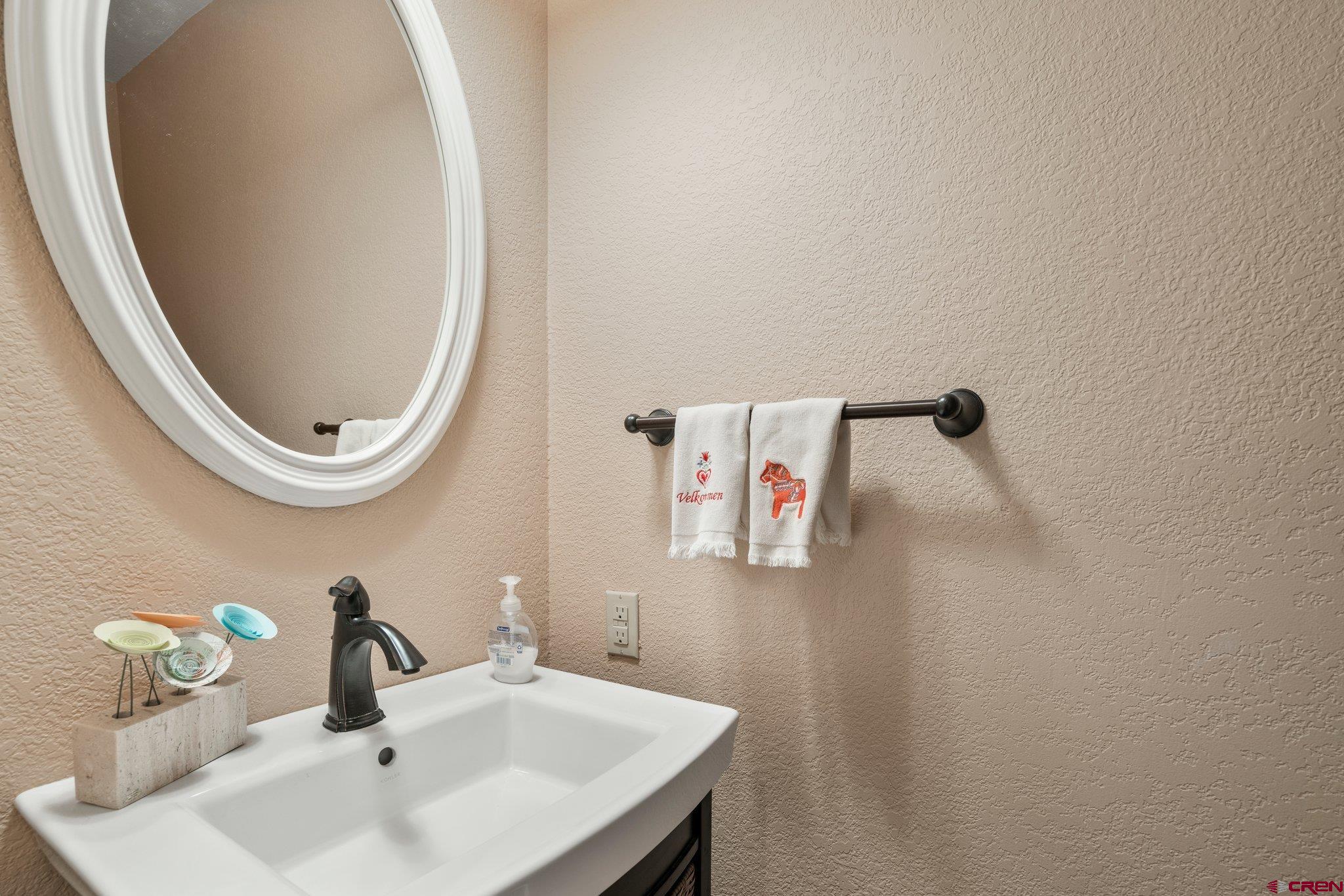 321 Pine Ridge Loop Durango, CO 81301 - Photo 19 of 35 a bathroom with a sink and a mirror