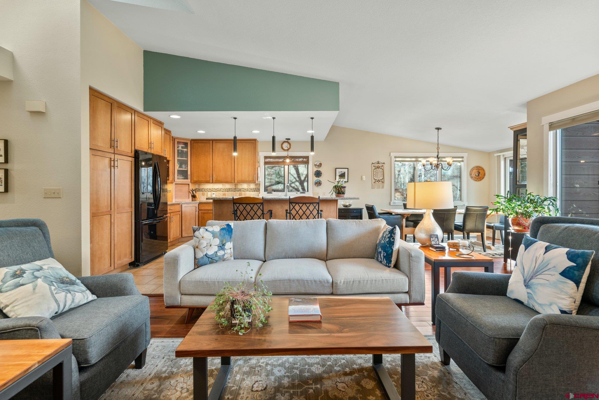 321 Pine Ridge Loop Durango, CO 81301 - Photo 2 of 35 a living room with furniture wooden floor and a view of kitchen