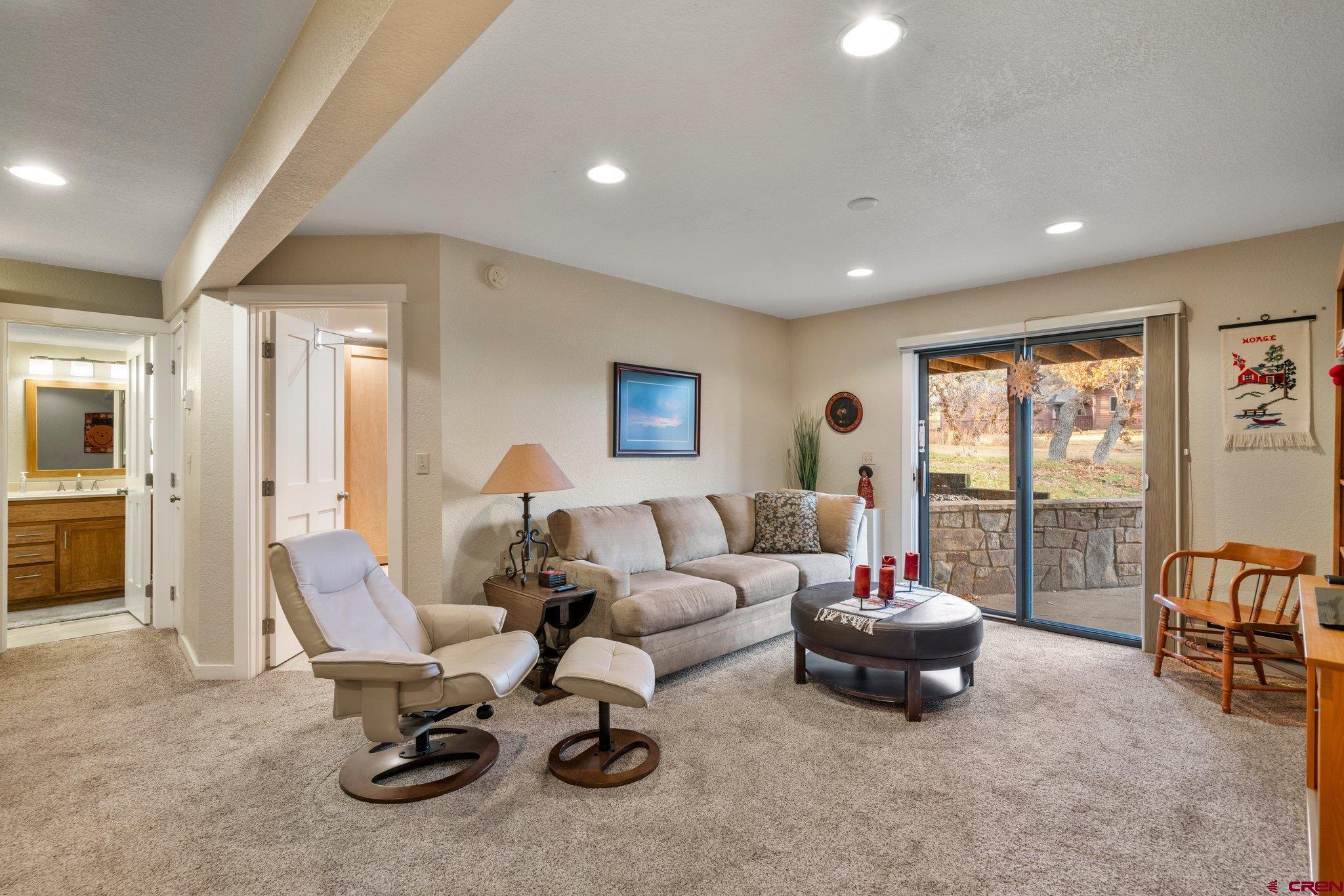 321 Pine Ridge Loop Durango, CO 81301 - Photo 23 of 35 a living room with furniture and a flat screen tv