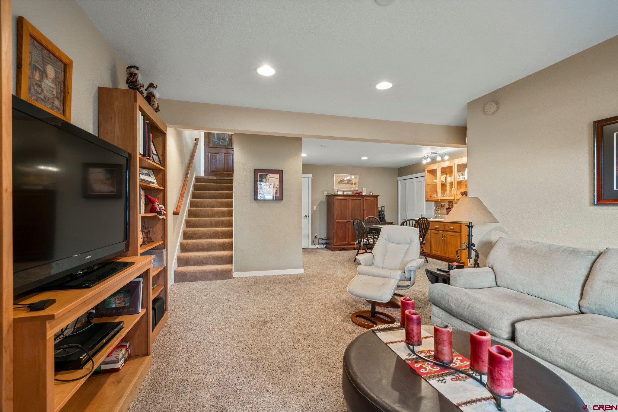 321 Pine Ridge Loop Durango, CO 81301 - Photo 24 of 35 a living room with furniture and a flat screen tv