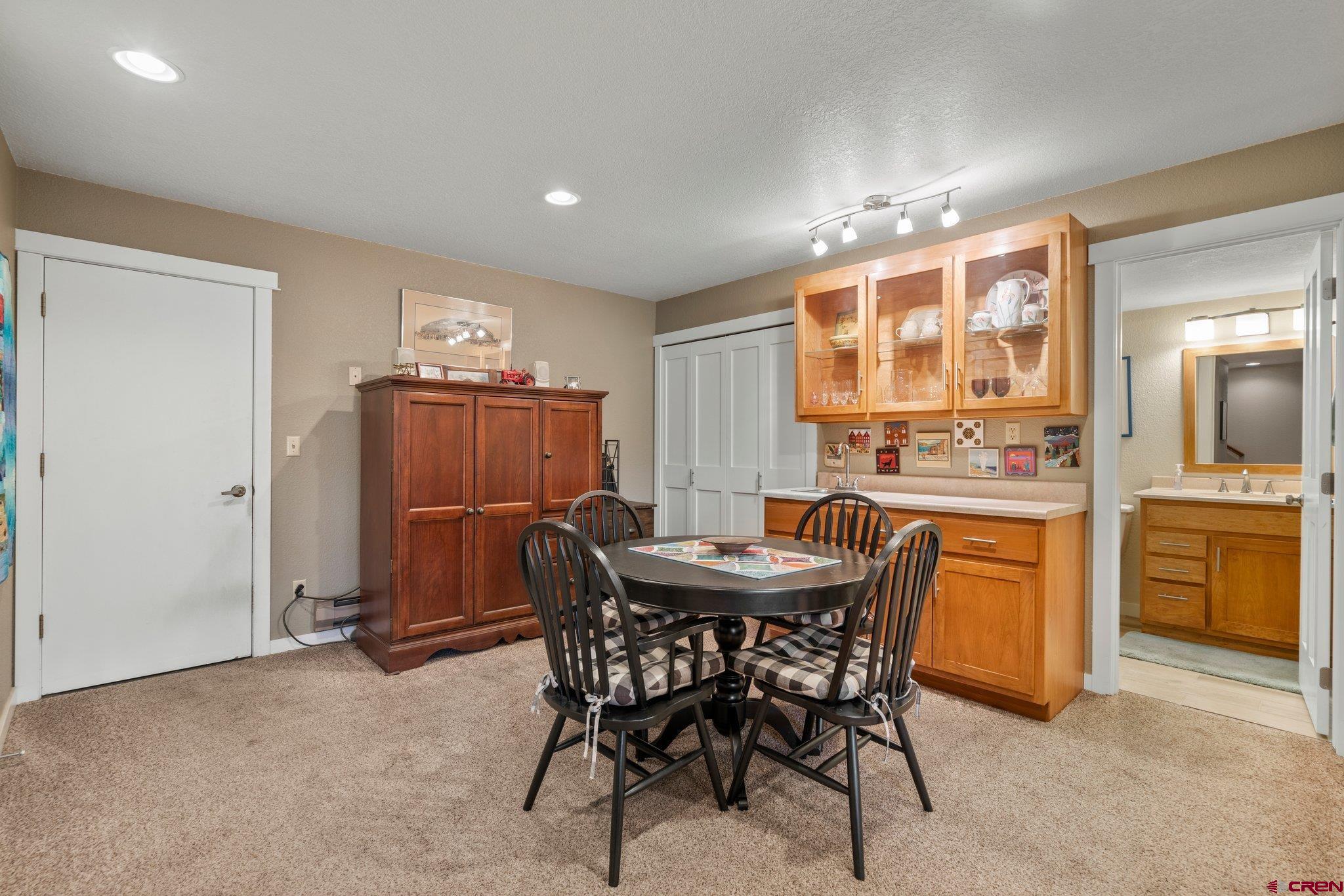 321 Pine Ridge Loop Durango, CO 81301 - Photo 25 of 35 a dining area with furniture a window and stainless steel appliances