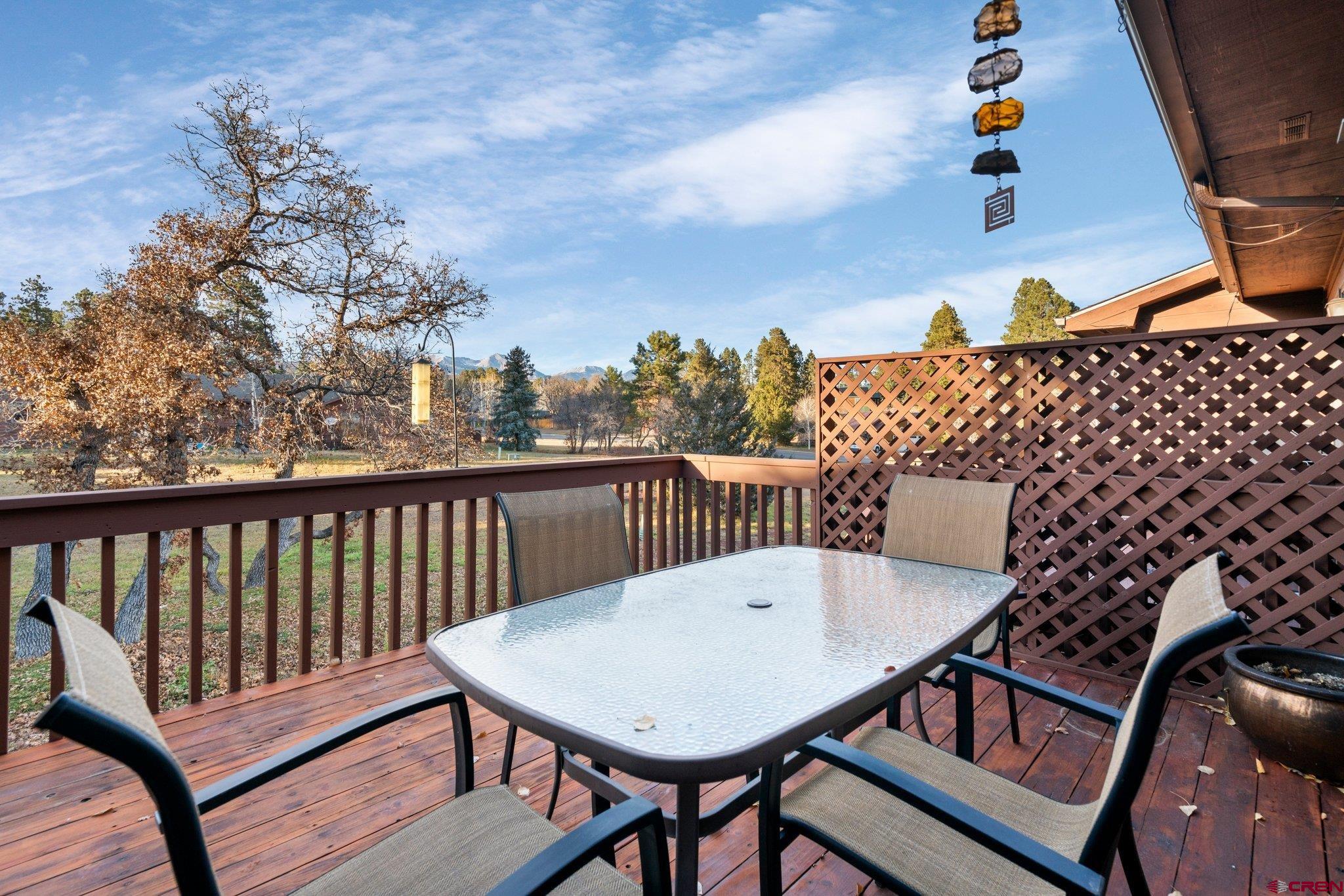 321 Pine Ridge Loop Durango, CO 81301 - Photo 28 of 35 a balcony with wooden floor table and chairs