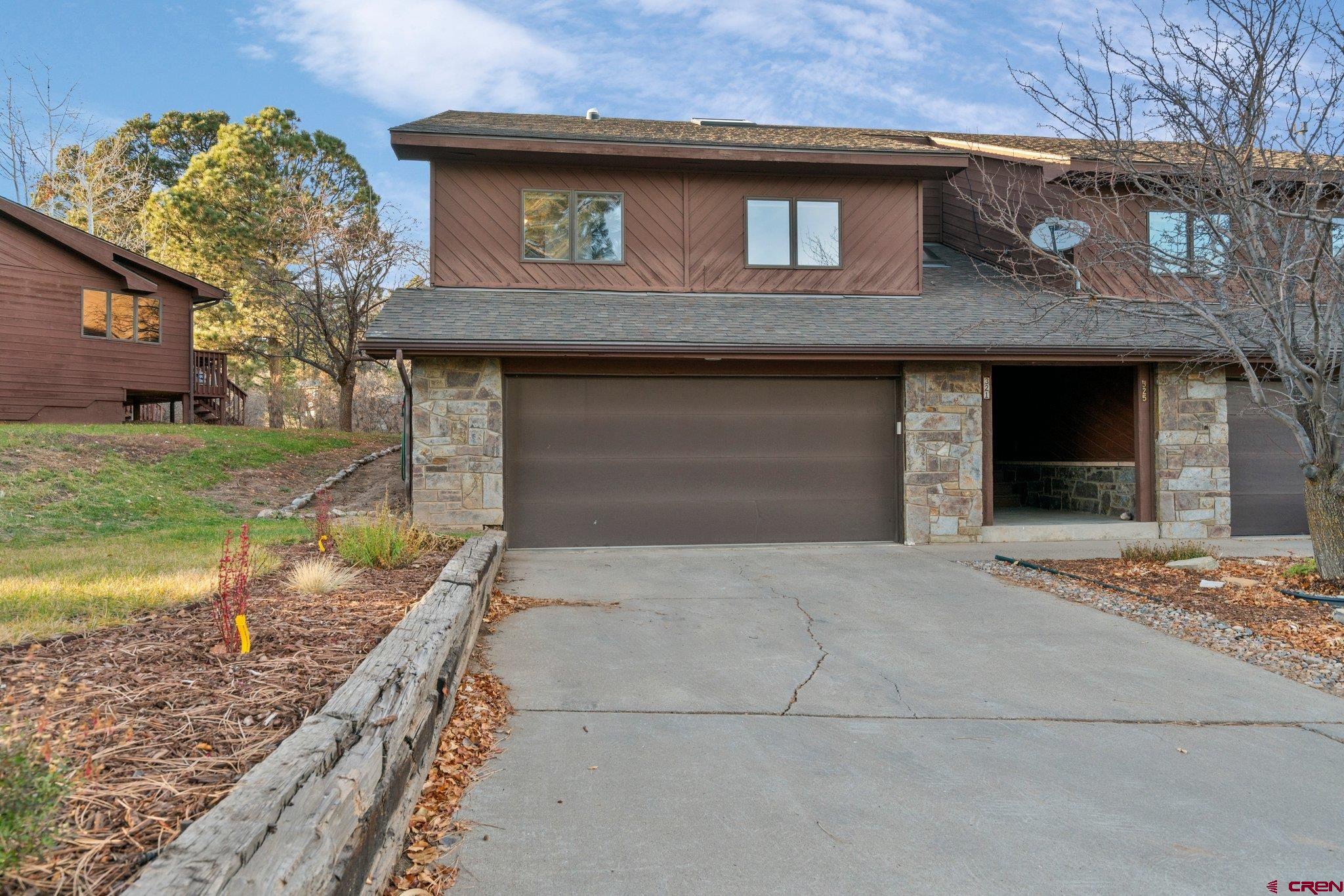 321 Pine Ridge Loop Durango, CO 81301 - Photo 31 of 35 a front view of a house with garden