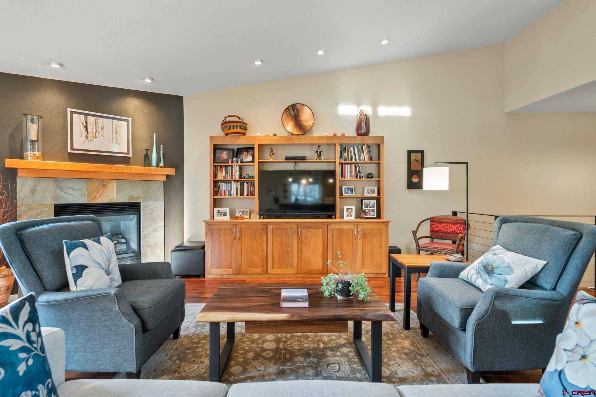 321 Pine Ridge Loop Durango, CO 81301 - Photo 5 of 35 a living room with furniture and a fireplace