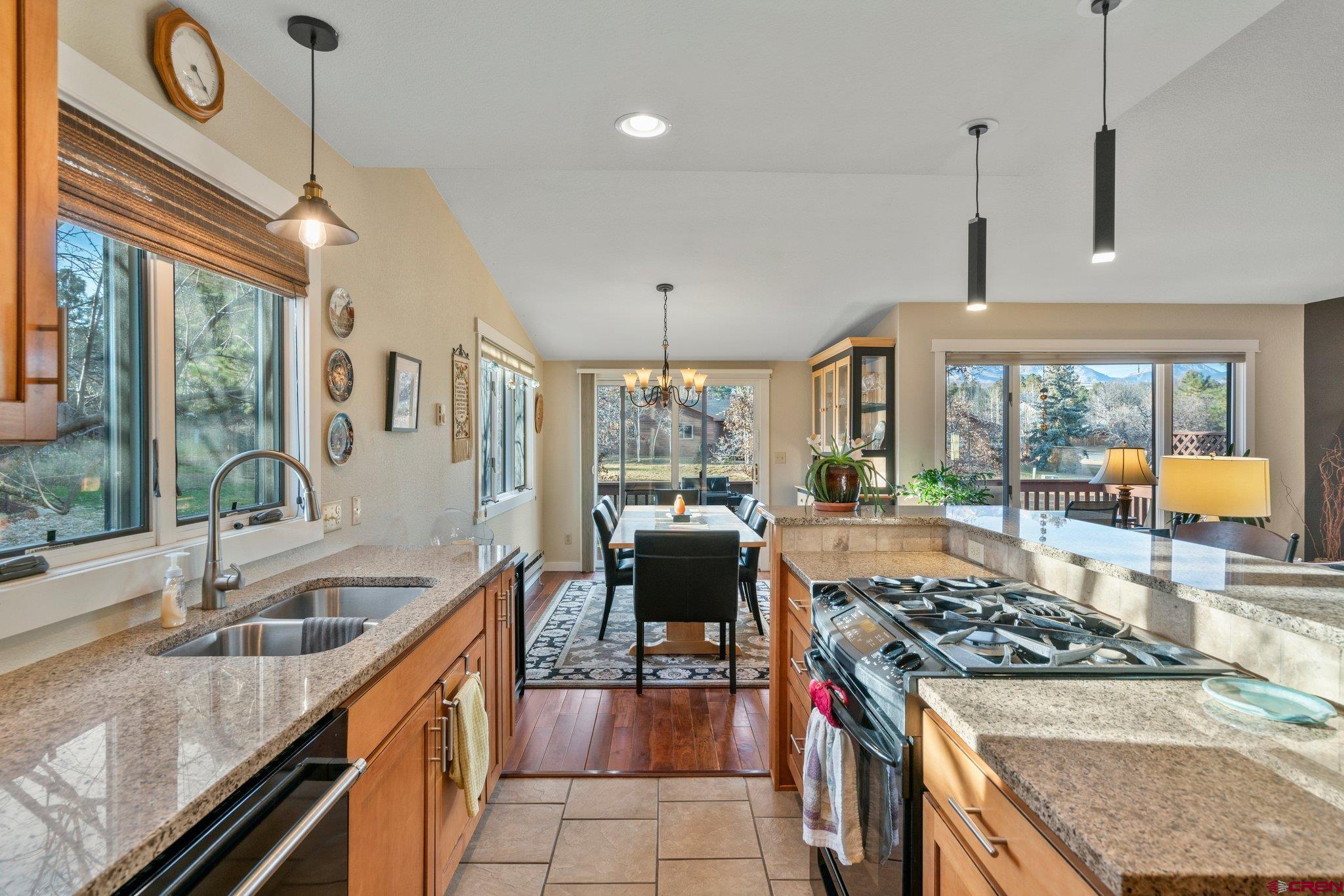 321 Pine Ridge Loop Durango, CO 81301 - Photo 6 of 35 a kitchen with a stove and a sink