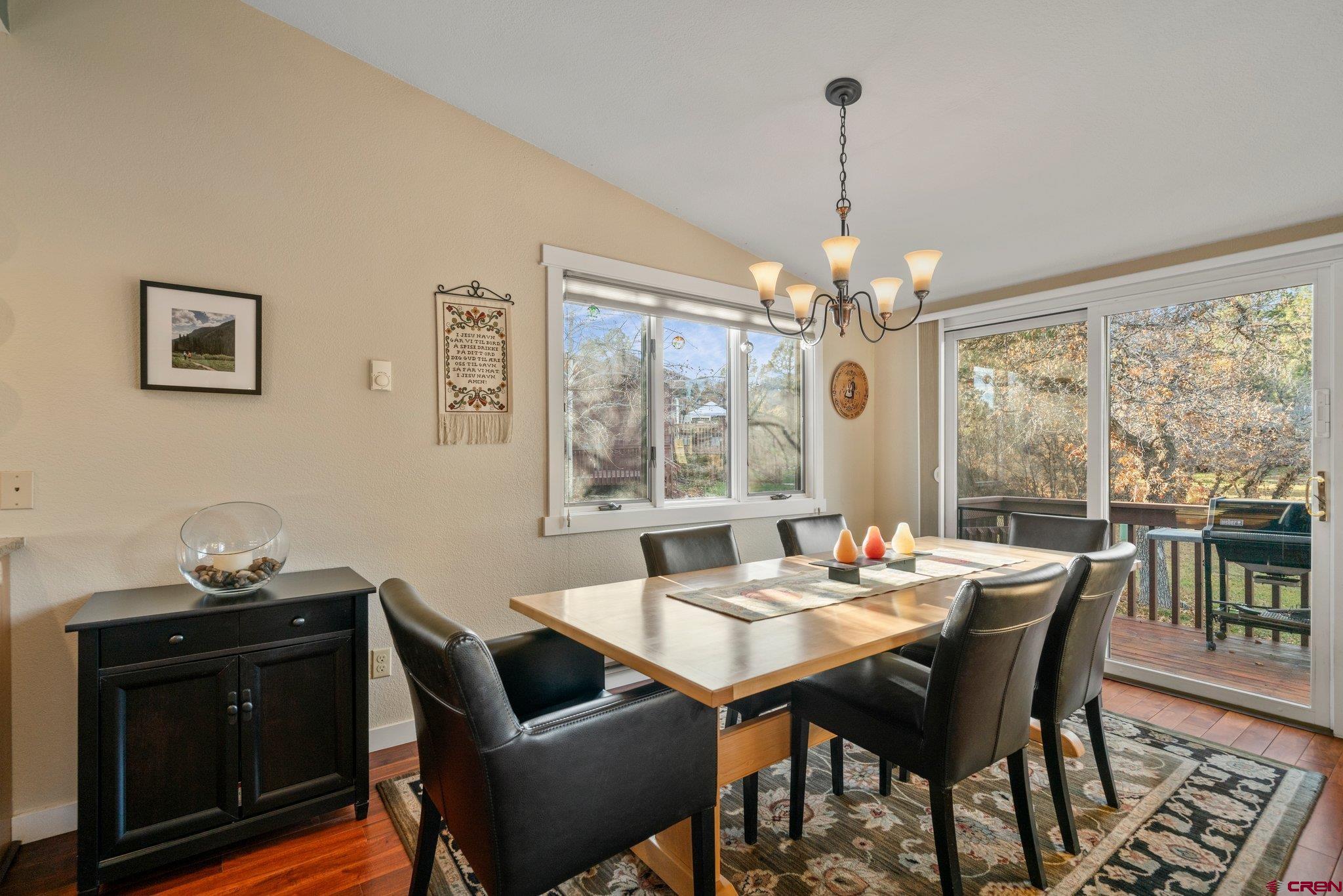 321 Pine Ridge Loop Durango, CO 81301 - Photo 10 of 35 a dining room with furniture a chandelier and window