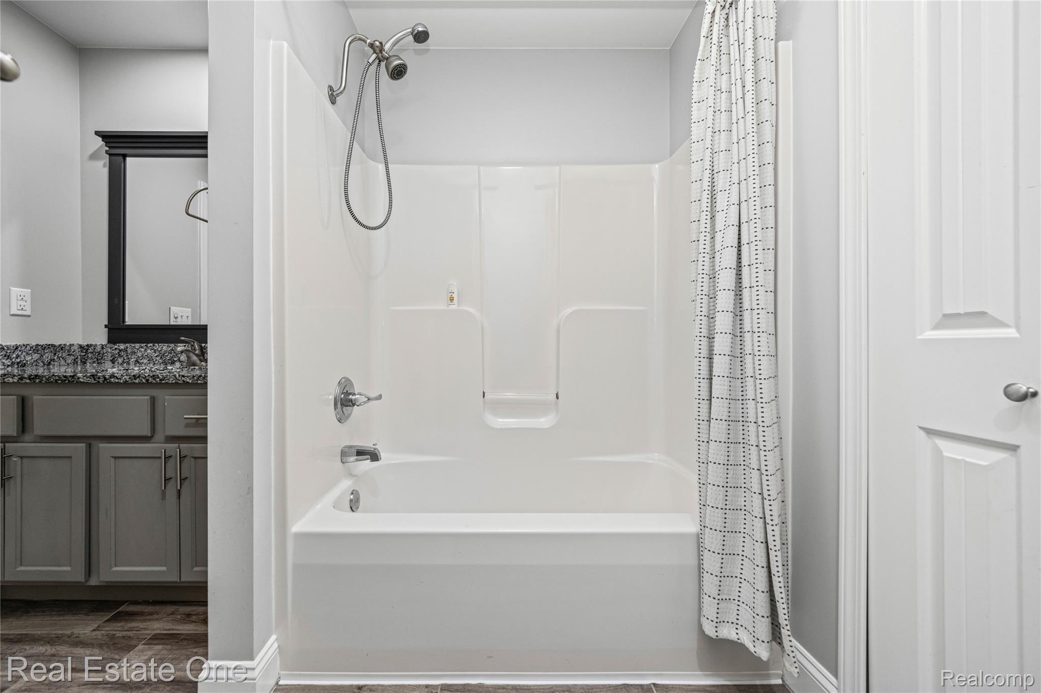 2479 Gibson Road Grand Blanc, MI 48439 - Photo 34 of 55 White tub and shower combination with chrome fixtures