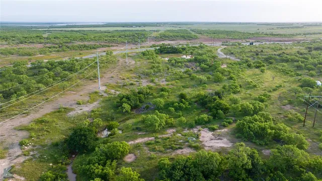 a view of a field with an ocean