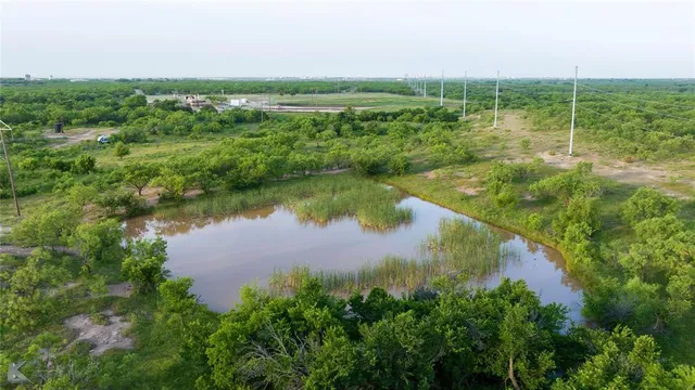 a view of a lake with a yard