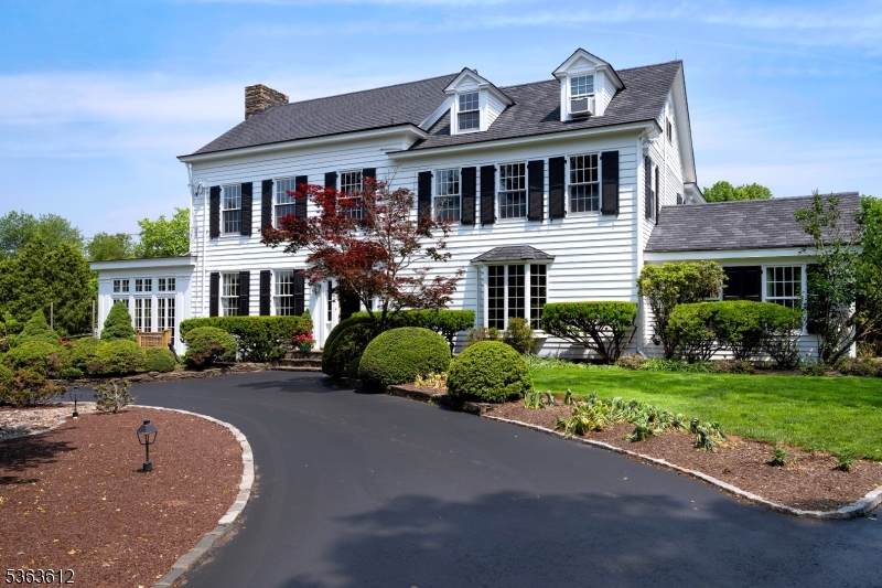 a front view of a house with a yard and porch