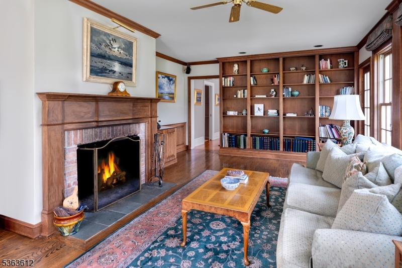 122 Bedens Brook Road Skillman, NJ 08558 - Photo 17 of 47 a living room with furniture a lamp and a fireplace