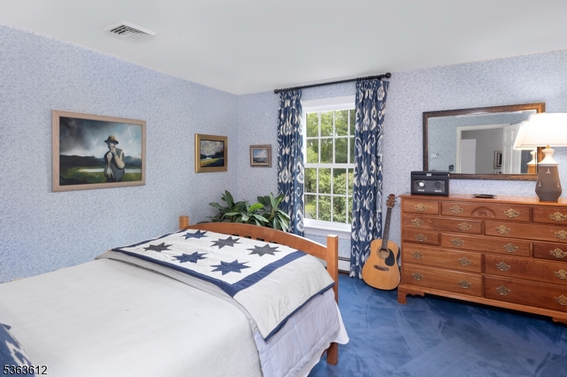 122 Bedens Brook Road Skillman, NJ 08558 - Photo 28 of 47 a bedroom with a bed and a dresser next to a window