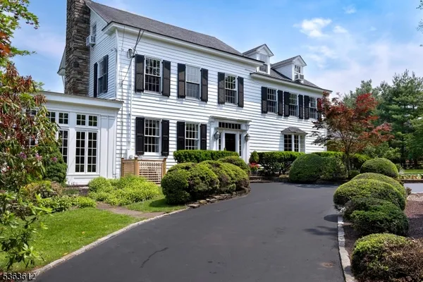 front view of a house with a garden