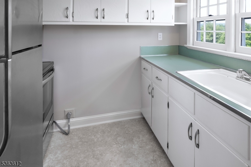 122 Bedens Brook Road Skillman, NJ 08558 - Photo 33 of 47 a kitchen with granite countertop a sink a stove and cabinets