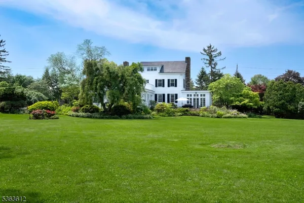 a view of a house with a big yard