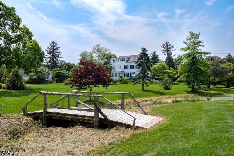 122 Bedens Brook Road Skillman, NJ 08558 - Photo 40 of 47 a view of swimming pool with a garden and trees