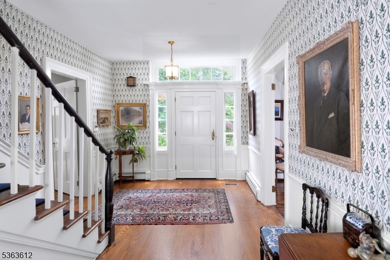 122 Bedens Brook Road Skillman, NJ 08558 - Photo 6 of 47 a view of an entryway with wooden floor and front door