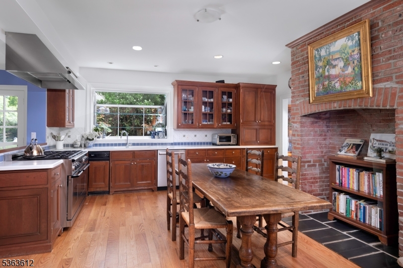 122 Bedens Brook Road Skillman, NJ 08558 - Photo 10 of 47 a kitchen with a table chairs stove and cabinets