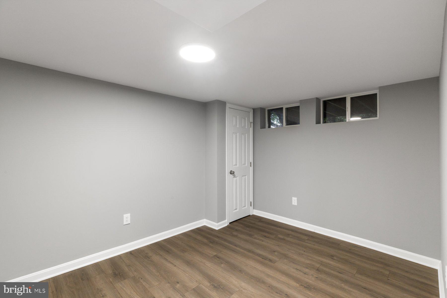 1579 Dellsway Road Towson, MD 21286 - Photo 23 of 33 a view of an empty room with wooden floor