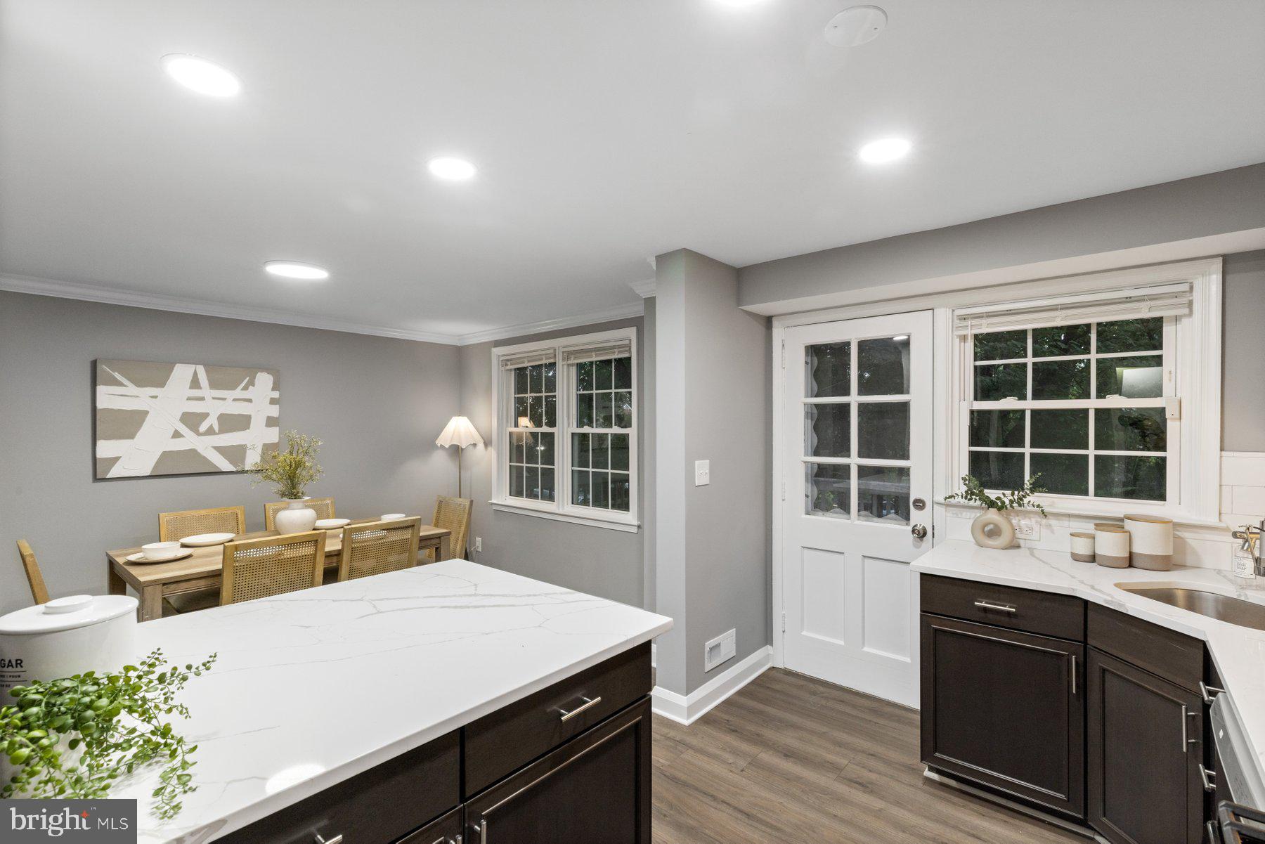 1579 Dellsway Road Towson, MD 21286 - Photo 6 of 33 a kitchen with a sink stove and cabinets