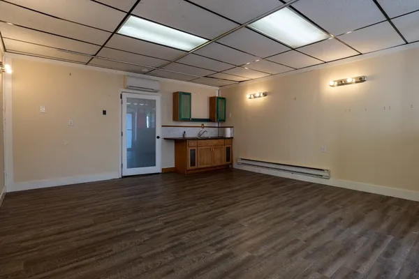 a view of a livingroom with wooden floor