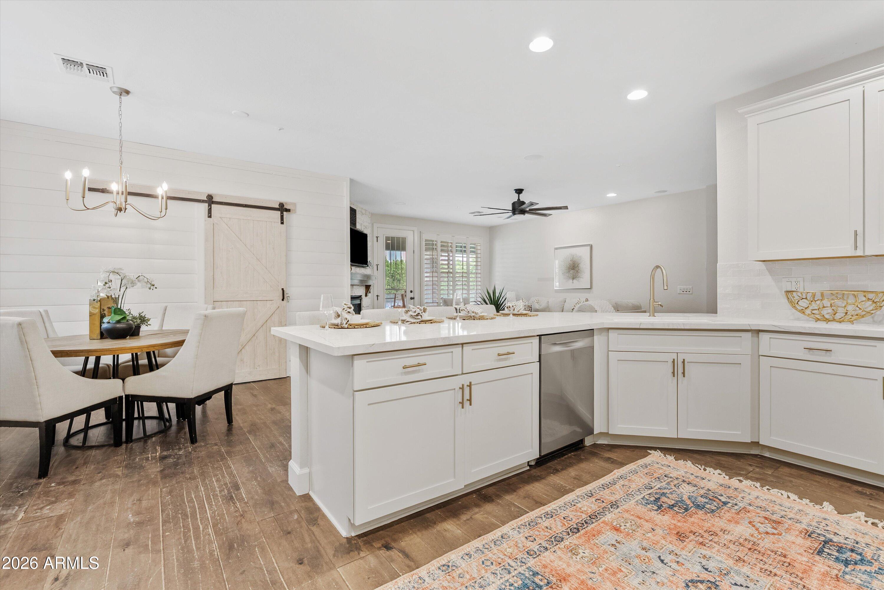 3112 East Agritopia Loop North Gilbert, AZ 85296 - Photo 14 of 40 a spacious bathroom with a sink a chair and a mirror